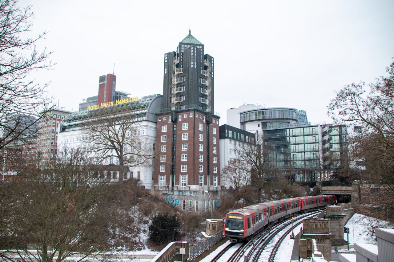 Services Snow-covered Hamburg with urban architecture and train in winter scene.
